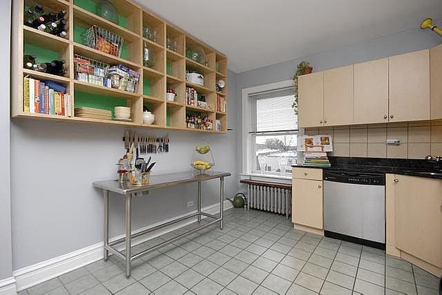 3135 W Leland Ave Unit 3W, Chicago, IL 60625 - kitchen featuring stainless steel dishwasher, radiator, dark countertops, light tile patterned floors, and open shelves