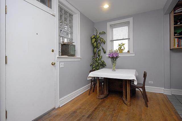 3135 W Leland Ave Unit 3W, Chicago, IL 60625 - dining area featuring baseboards and wood finished floors