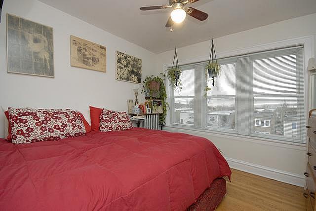 3135 W Leland Ave Unit 3W, Chicago, IL 60625 - bedroom with wood finished floors and ceiling fan