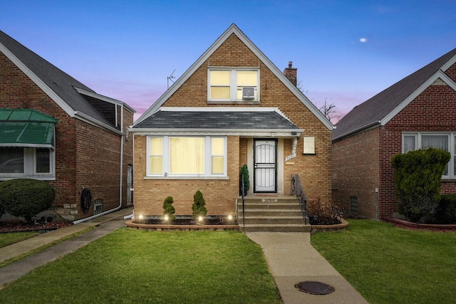8020 S Mozart St, Chicago, IL 60652 - view of front of home with a chimney, a shingled roof, a lawn, and brick siding