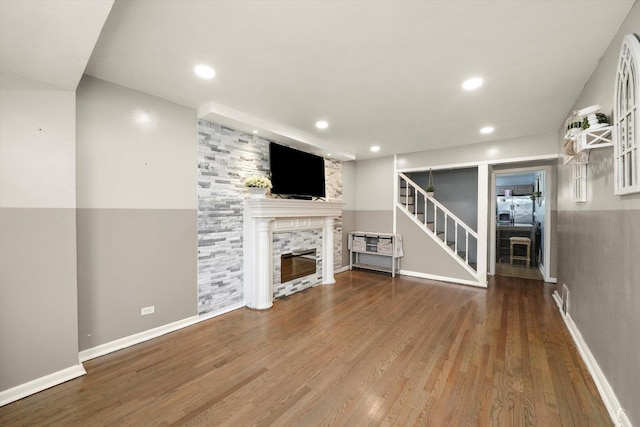 8020 S Mozart St, Chicago, IL 60652 - unfurnished living room featuring a fireplace, wood finished floors, stairs, and recessed lighting