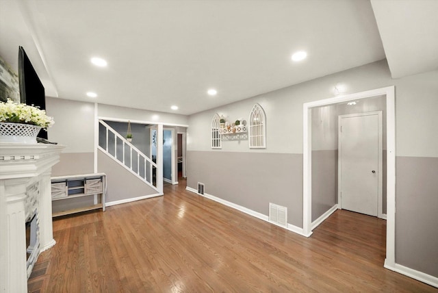 8020 S Mozart St, Chicago, IL 60652 - unfurnished living room with stairs, wood finished floors, recessed lighting, and a fireplace