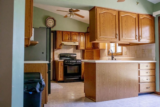 202 E 8th St, Gridley, IL 61744 - kitchen featuring black gas range oven, under cabinet range hood, a ceiling fan, backsplash, and light tile patterned flooring
