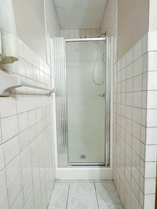 202 E 8th St, Gridley, IL 61744 - full bath with tile walls, a shower stall, and tile patterned flooring