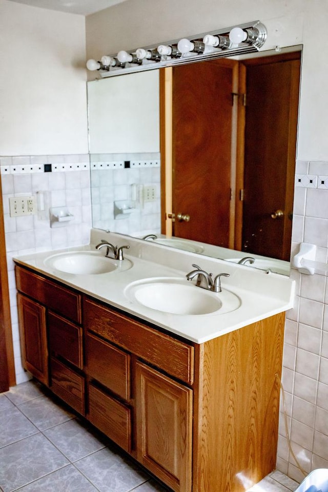202 E 8th St, Gridley, IL 61744 - bathroom with double vanity, tile patterned flooring, and tile walls