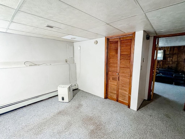 202 E 8th St, Gridley, IL 61744 - unfurnished bedroom with a closet, a drop ceiling, baseboard heating, and carpet flooring
