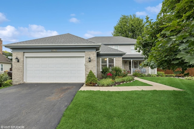 1177 Dovercliff Way, Crystal Lake, IL 60014 - view of front facade featuring brick siding, asphalt driveway, a garage, roof with shingles, and covered porch