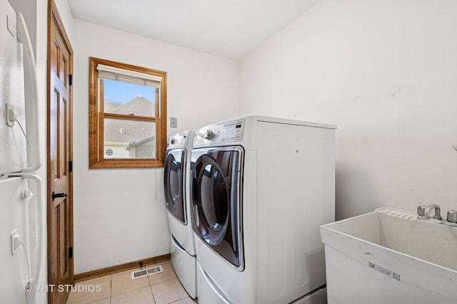 1177 Dovercliff Way, Crystal Lake, IL 60014 - washroom featuring separate washer and dryer and light tile patterned floors