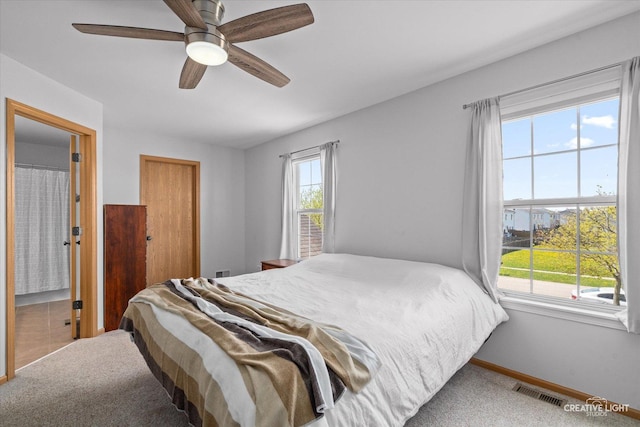 307 Gregory Ln, Plano, IL 60545 - carpeted bedroom featuring baseboards and a ceiling fan
