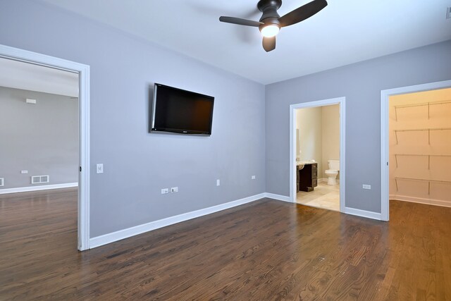 315 N Ridgeland Ave, Elmhurst, IL 60126 - unfurnished bedroom with a walk in closet, dark wood-style floors, connected bathroom, and ceiling fan