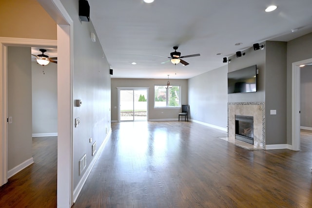 315 N Ridgeland Ave, Elmhurst, IL 60126 - unfurnished living room with ceiling fan, a tiled fireplace, recessed lighting, and wood finished floors