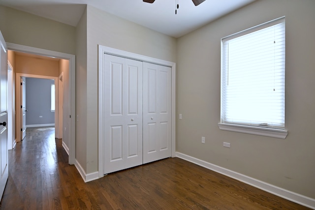 315 N Ridgeland Ave, Elmhurst, IL 60126 - unfurnished bedroom with dark wood-type flooring, a closet, and a ceiling fan