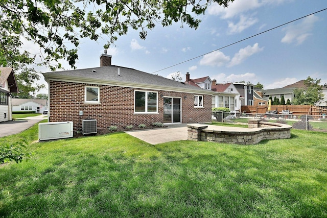 315 N Ridgeland Ave, Elmhurst, IL 60126 - rear view of property featuring brick siding, a patio, a chimney, and a shingled roof