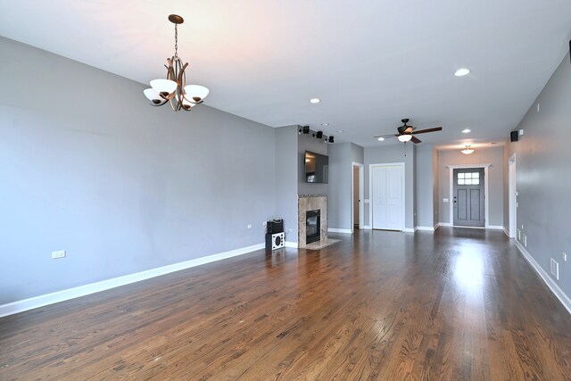 315 N Ridgeland Ave, Elmhurst, IL 60126 - unfurnished living room with a chandelier, ceiling fan, a tile fireplace, recessed lighting, and dark wood-type flooring
