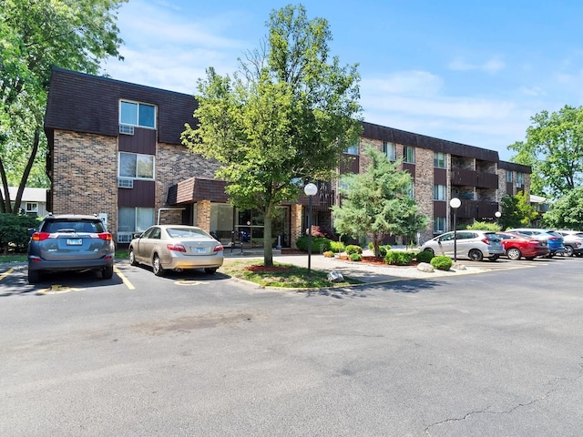 940 E Old Willow Rd Unit 305, Prospect Heights, IL 60070 - view of property featuring uncovered parking