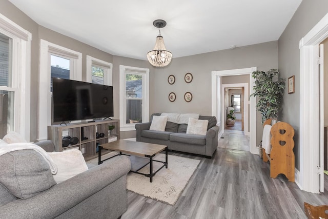 1404 Fell Ave, Bloomington, IL 61701 - living room featuring wood finished floors and a chandelier