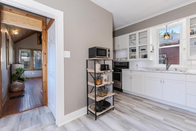 1404 Fell Ave, Bloomington, IL 61701 - kitchen with stainless steel appliances, light wood-type flooring, white cabinetry, glass insert cabinets, and ornamental molding