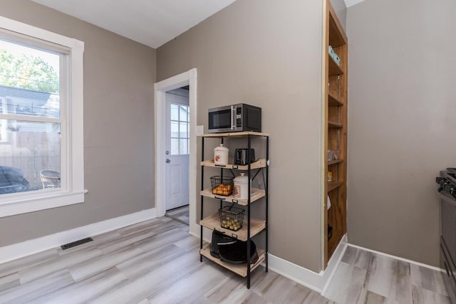 1404 Fell Ave, Bloomington, IL 61701 - detailed view of stainless steel microwave and wood finished floors