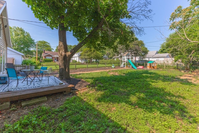 1404 Fell Ave, Bloomington, IL 61701 - fenced backyard with a playground and a deck
