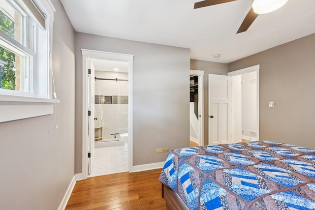 105 E Vermont St, Villa Park, IL 60181 - bedroom featuring wood finished floors, connected bathroom, a closet, and ceiling fan