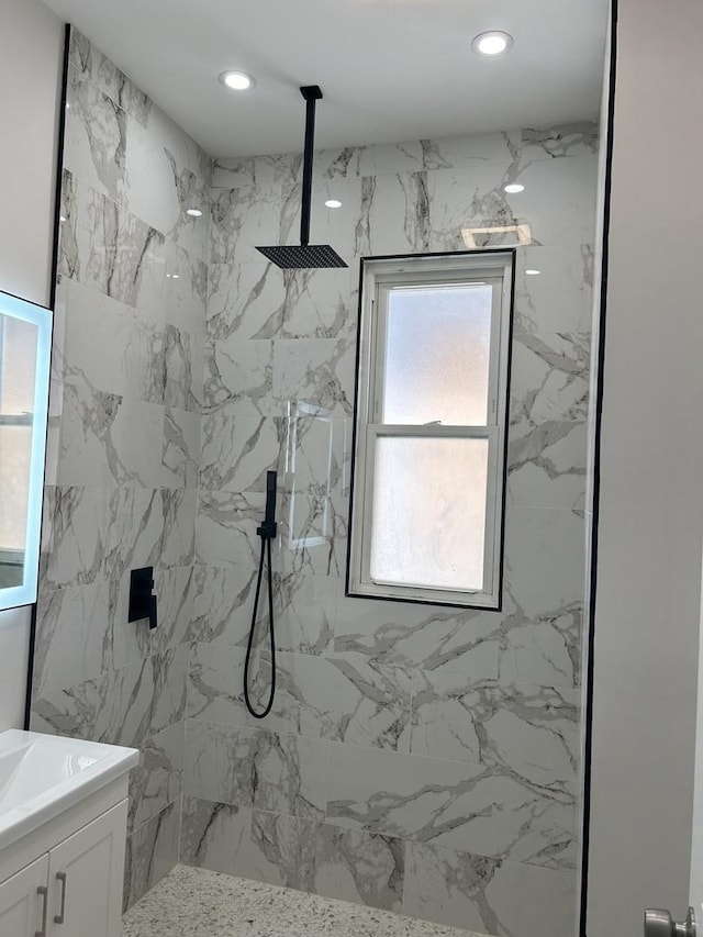 1122 N Mason Ave, Chicago, IL 60651 - bathroom featuring vanity, a marble finish shower, and recessed lighting