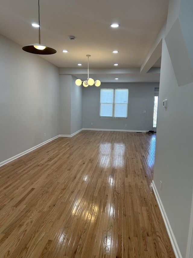 1122 N Mason Ave, Chicago, IL 60651 - spare room featuring hardwood / wood-style floors, a smoke detector, and recessed lighting