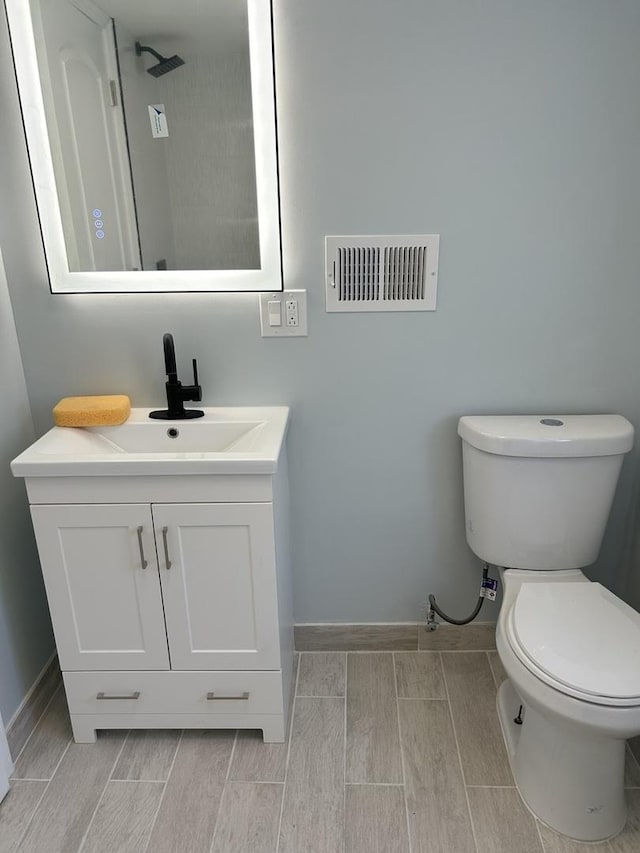 1122 N Mason Ave, Chicago, IL 60651 - bathroom with vanity and wood tiled floors