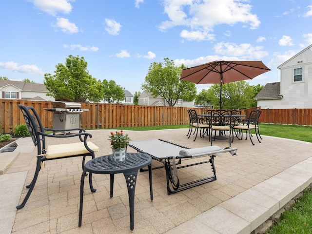 9312 Bristol Ln, Huntley, IL 60142 - fenced backyard featuring a patio area, a grill, and outdoor dining space