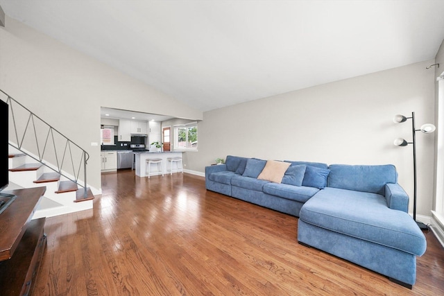 56 W Granville Ave, Roselle, IL 60172 - living room with wood finished floors, stairway, and vaulted ceiling