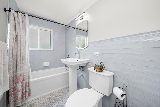 56 W Granville Ave, Roselle, IL 60172 - full bathroom featuring shower / tub combo with curtain, tile walls, tile patterned flooring, and a wainscoted wall