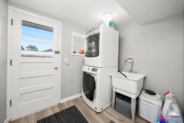 56 W Granville Ave, Roselle, IL 60172 - laundry area featuring stacked washing machine and dryer and light wood-style floors