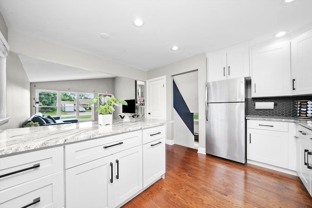 56 W Granville Ave, Roselle, IL 60172 - kitchen featuring freestanding refrigerator, white cabinetry, decorative backsplash, recessed lighting, and wood finished floors