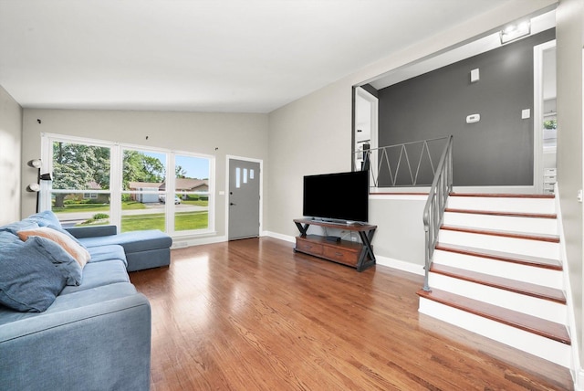 56 W Granville Ave, Roselle, IL 60172 - living room featuring wood finished floors, vaulted ceiling, and stairway