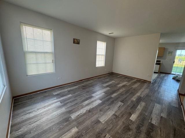 923 E Savannah Dr, Romeoville, IL 60446 - unfurnished room featuring dark wood finished floors and baseboards