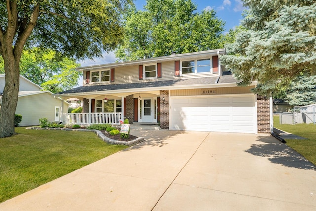 6S184 Lakewood Dr, Naperville, IL 60540 - view of front of property featuring brick siding, a porch, driveway, and a front lawn