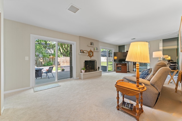 6S184 Lakewood Dr, Naperville, IL 60540 - living room with light carpet and a brick fireplace