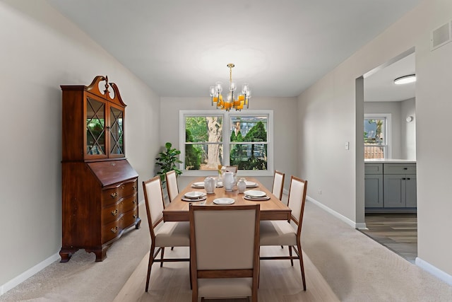 6S184 Lakewood Dr, Naperville, IL 60540 - dining space featuring plenty of natural light, a chandelier, and light colored carpet