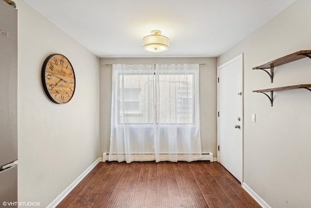 6839 N NW Hwy Unit 2B, Chicago, IL 60631 - unfurnished dining area featuring a baseboard radiator and dark wood-style floors