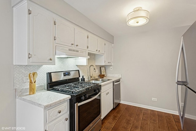 6839 N NW Hwy Unit 2B, Chicago, IL 60631 - kitchen featuring stainless steel appliances, under cabinet range hood, dark wood-style floors, tasteful backsplash, and white cabinets