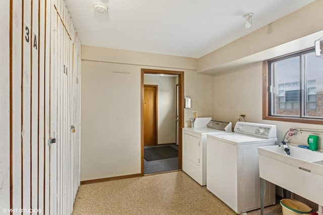6839 N NW Hwy Unit 2B, Chicago, IL 60631 - washroom with washer and clothes dryer and baseboards