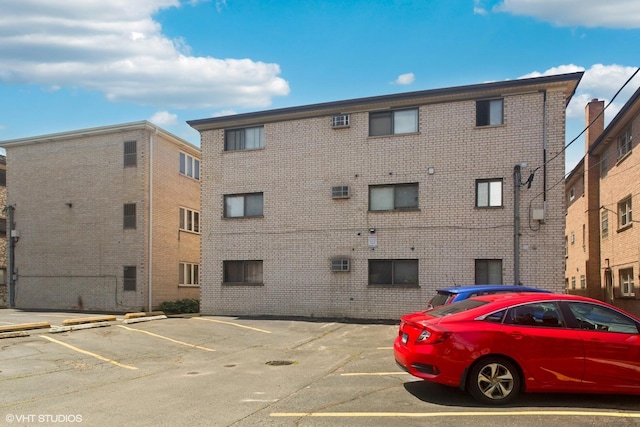 6839 N NW Hwy Unit 2B, Chicago, IL 60631 - view of apartment building / complex featuring uncovered parking