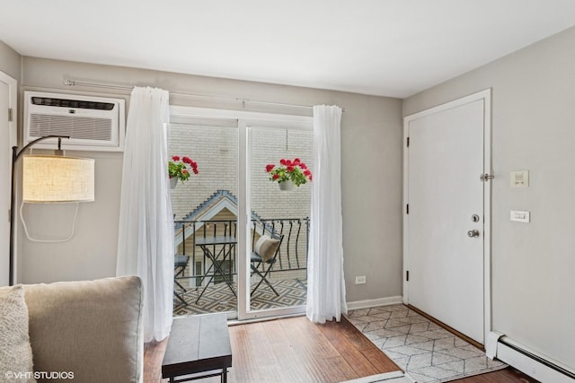 6839 N NW Hwy Unit 2B, Chicago, IL 60631 - entrance foyer featuring a baseboard radiator, wood finished floors, and a wall unit AC