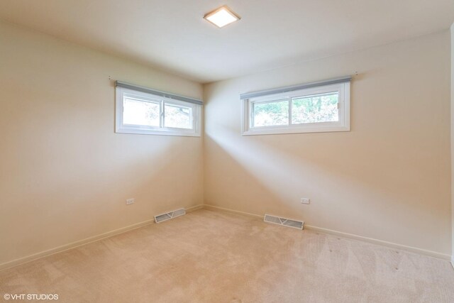 1036 Perda Ln, Des Plaines, IL 60016 - spare room featuring light carpet and baseboards