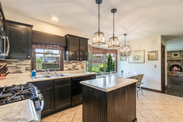 1148 N Anvil Ct, Addison, IL 60101 - kitchen with black dishwasher, light tile patterned floors, plenty of natural light, and tasteful backsplash
