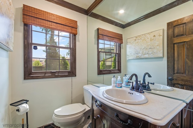 1148 N Anvil Ct, Addison, IL 60101 - half bath with vanity, ornamental molding, and healthy amount of natural light