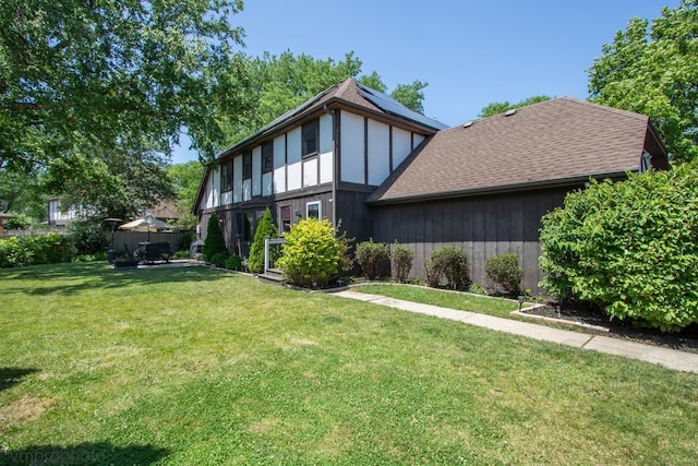1148 N Anvil Ct, Addison, IL 60101 - rear view of property with roof mounted solar panels and a shingled roof