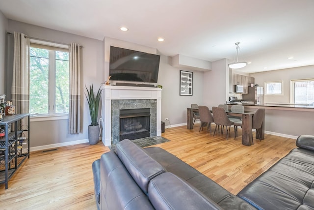 641 S Maple Ave Unit I, Oak Park, IL 60304 - living room with light wood-type flooring, a tile fireplace, and recessed lighting