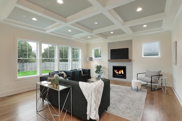 1947 Summerton Pl, Northbrook, IL 60062 - living room featuring healthy amount of natural light, a warm lit fireplace, coffered ceiling, light wood-style flooring, and beam ceiling