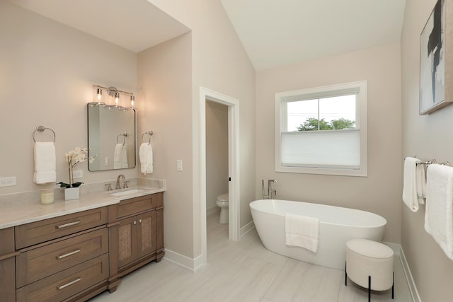 1947 Summerton Pl, Northbrook, IL 60062 - full bathroom with vanity, a freestanding tub, and vaulted ceiling