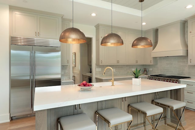 1947 Summerton Pl, Northbrook, IL 60062 - kitchen with stainless steel appliances, premium range hood, tasteful backsplash, light wood-style floors, and recessed lighting